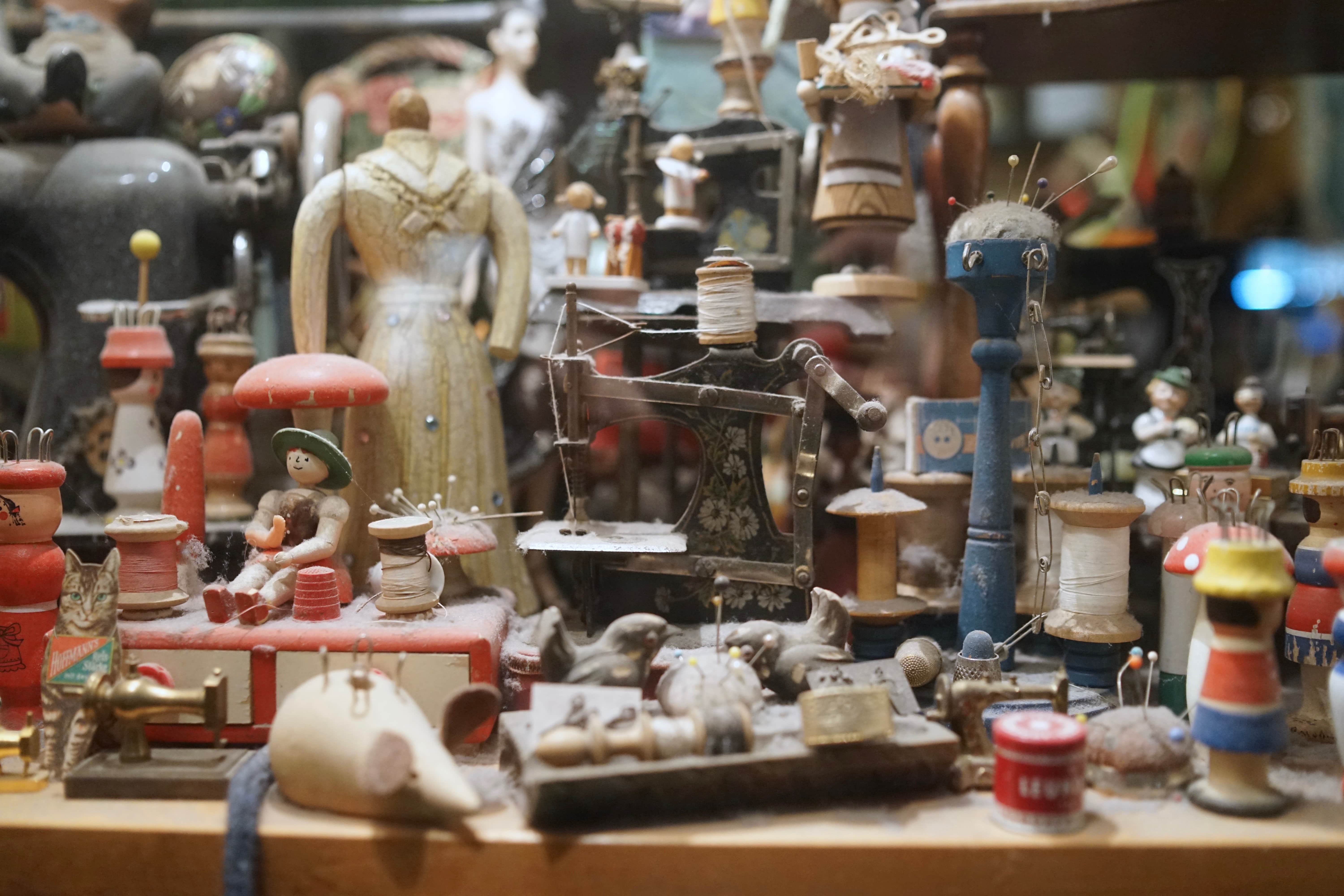 table full of collectibles and antiques ready to be sold